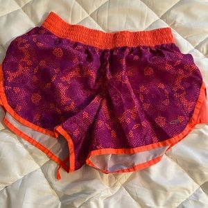 pink and orange running shorts